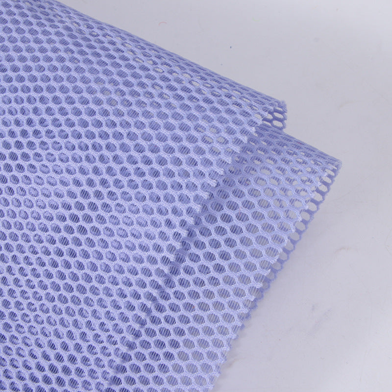 "Manufacturer in-stock single-layer round hole mesh fabric, round hole double-round brushed mesh fabric, breathable mesh fabric for bags, handbags, and sofas."